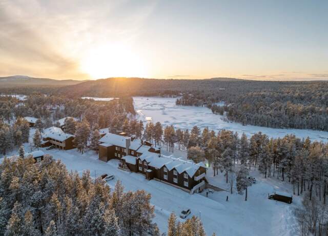 Wilderness Hotel Juutua in Finnish Lapland, Winter , drone view, Juutua river shore